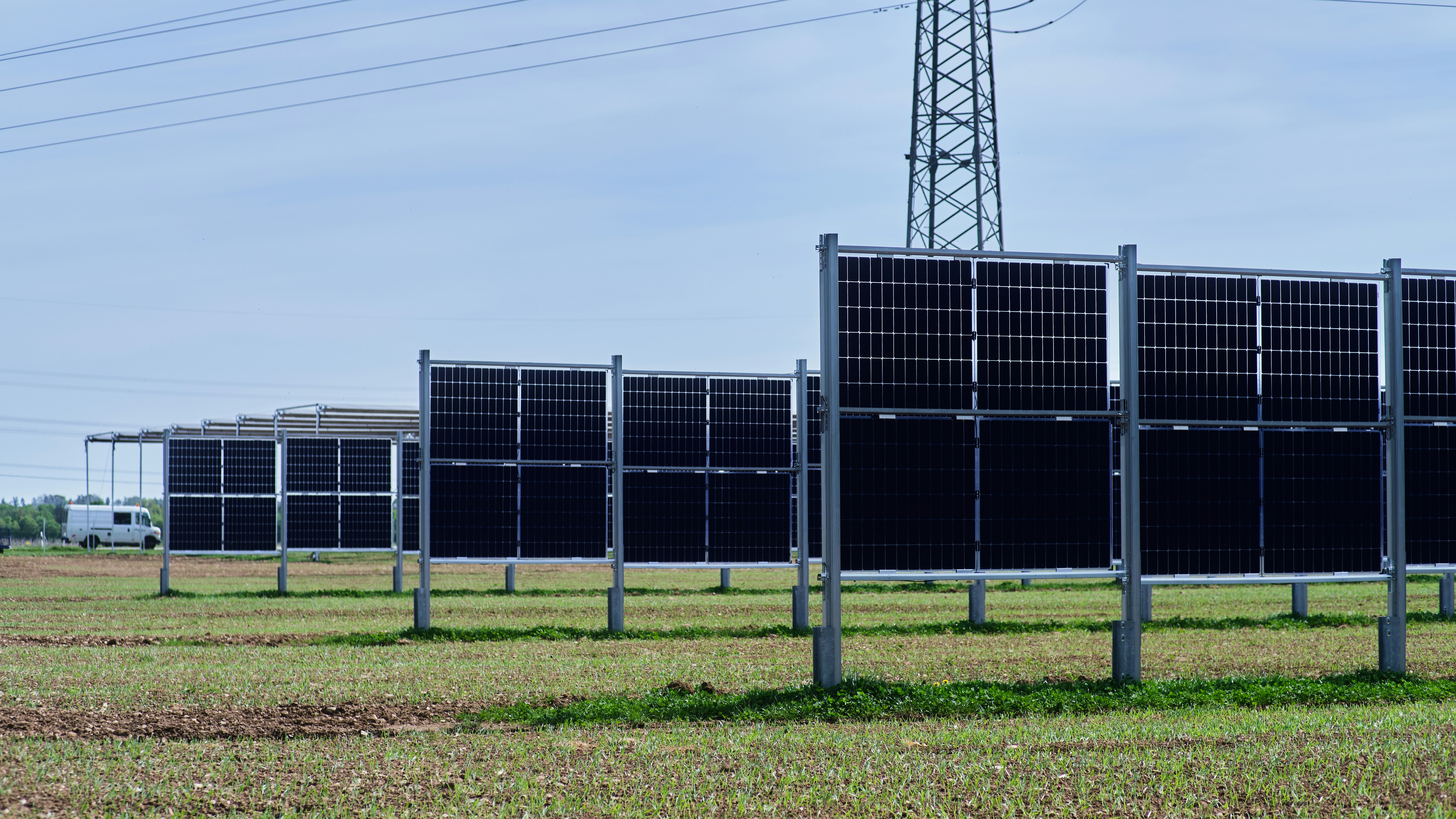 A vast utility-scale solar farm at sunset